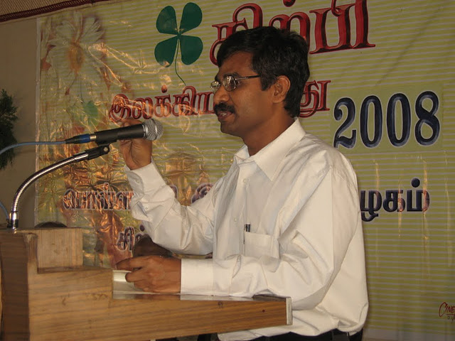 V. Irai Anbu speaking at a literary event in 2008